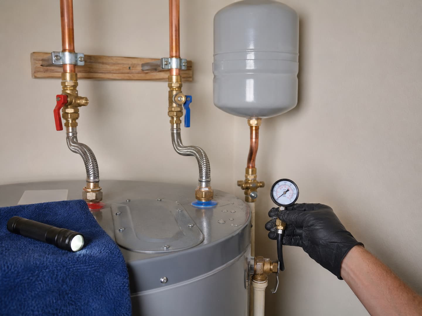 Water heater area inspected during water pressure regulator service